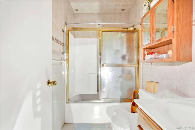 a bathroom with a tub and shower
