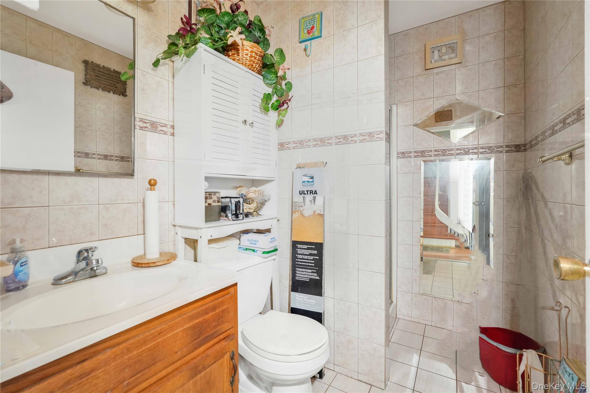 49 Hull Street Brooklyn, NY 11233 - Photo 10 of 31 a bathroom with a sink toilet and shower