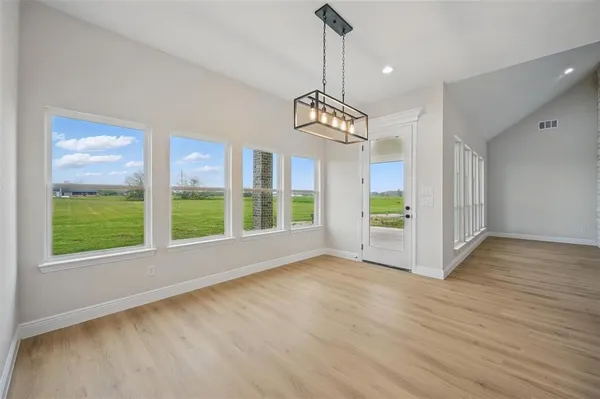 a view of kitchen with sink and wooden floor