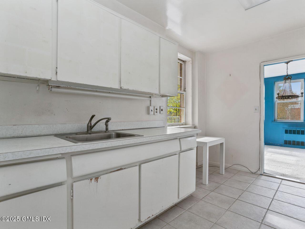 3 Putnam Hill, Unit 2B Greenwich, CT 06830 - Photo 13 of 23 a kitchen with a sink and cabinets
