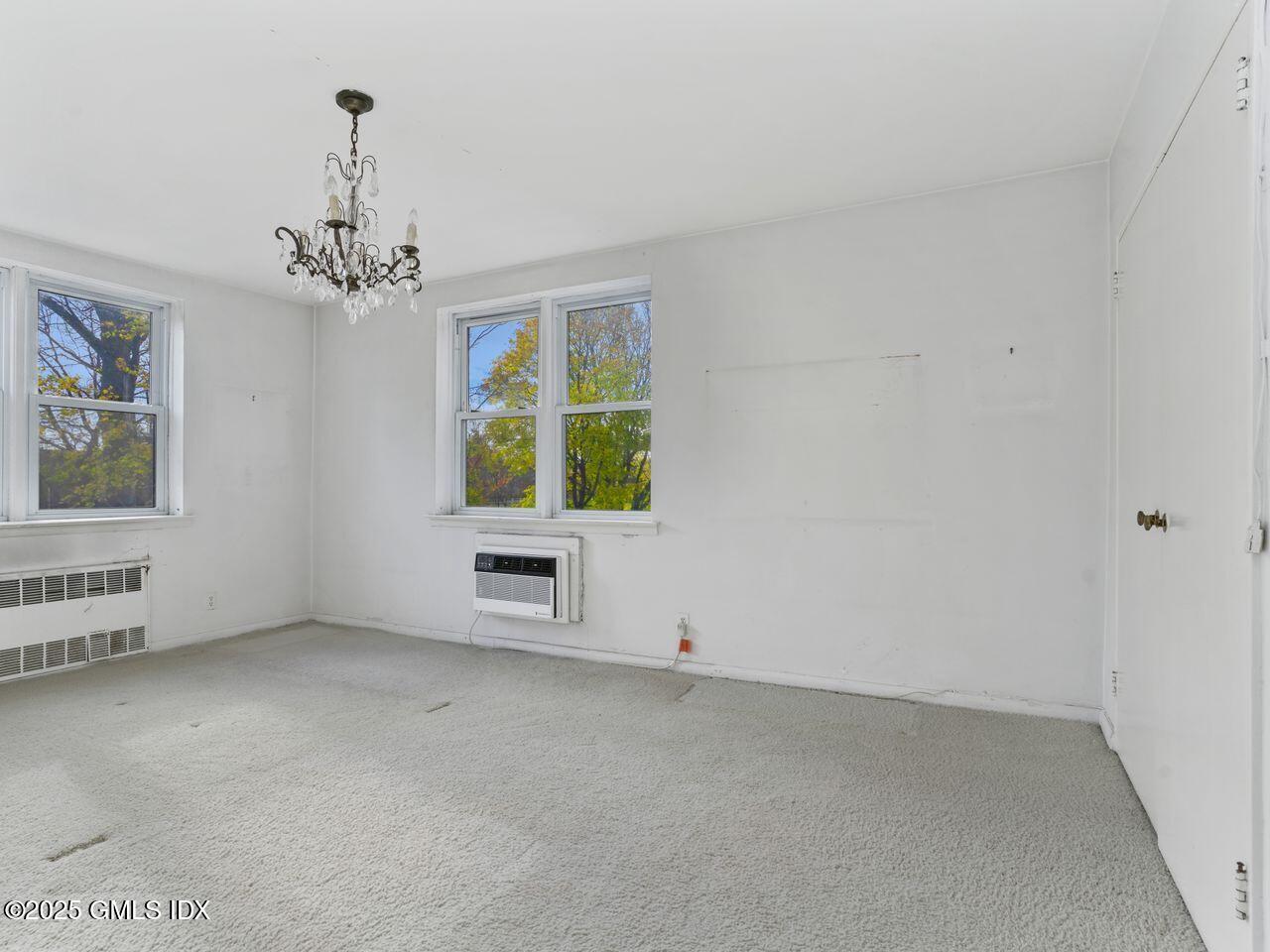 3 Putnam Hill, Unit 2B Greenwich, CT 06830 - Photo 16 of 23 an empty room with windows