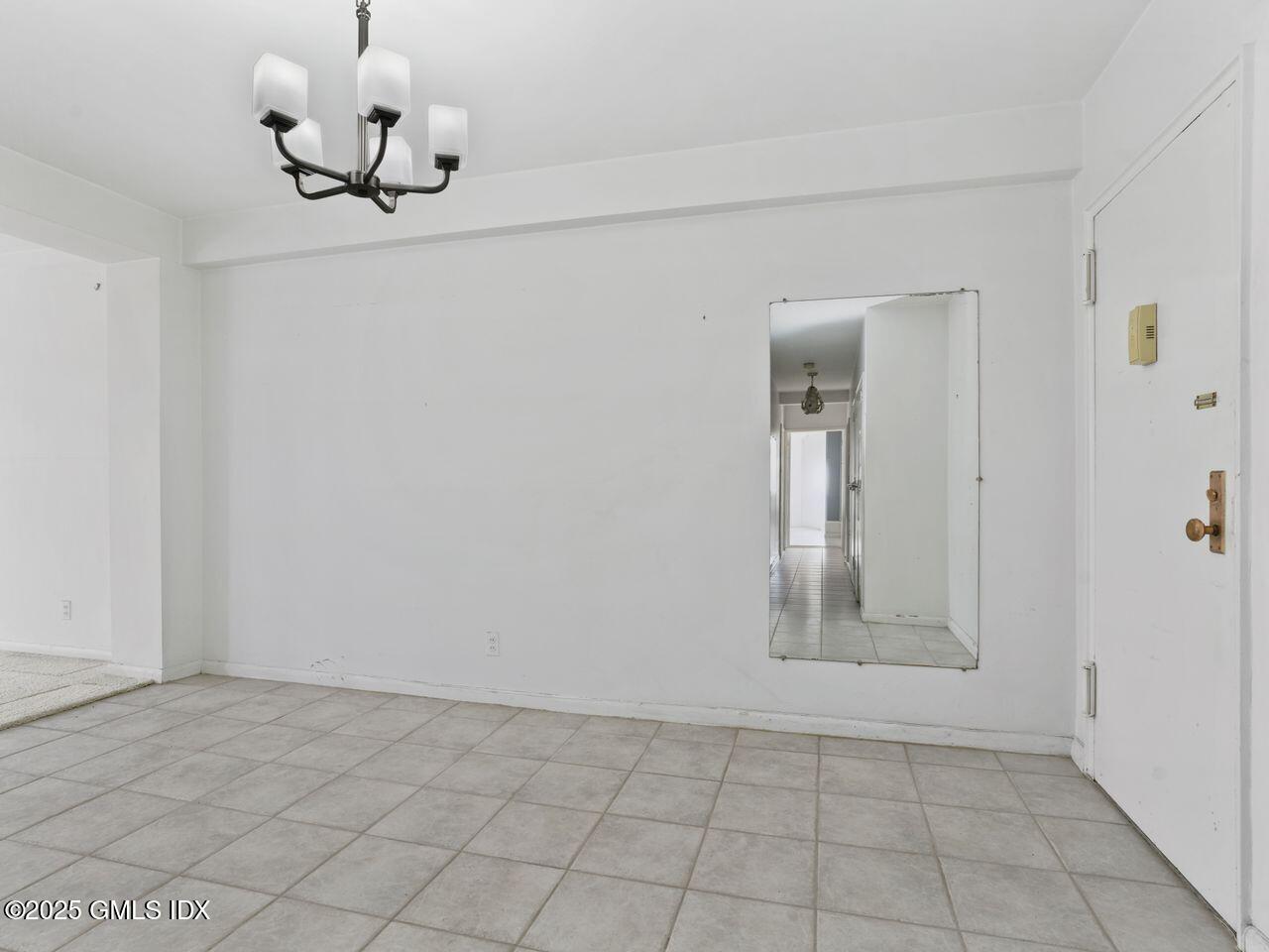 3 Putnam Hill, Unit 2B Greenwich, CT 06830 - Photo 6 of 23 a view of an empty room and chandelier fan