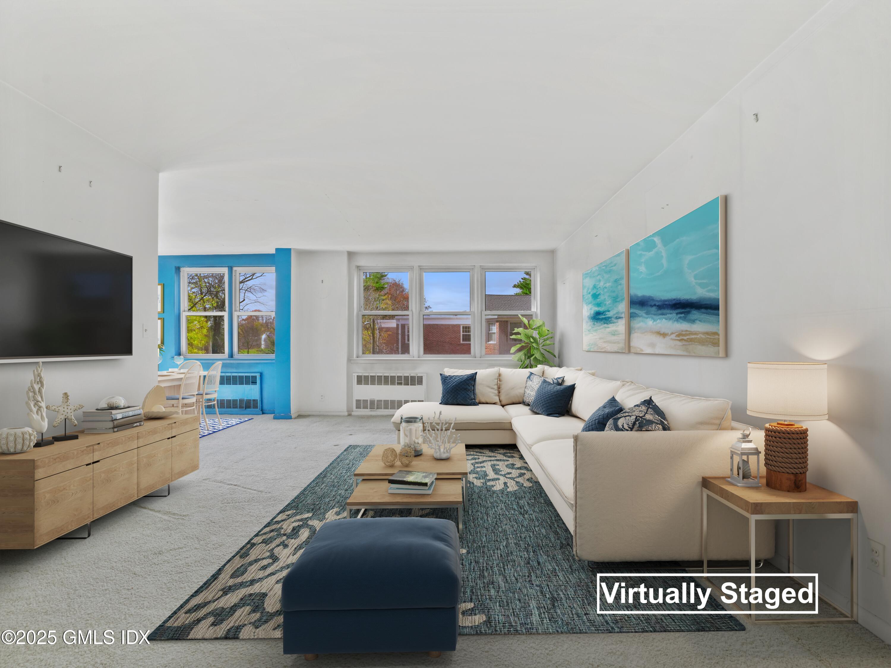 3 Putnam Hill, Unit 2B Greenwich, CT 06830 - Photo 8 of 23 a living room with furniture and a flat screen tv