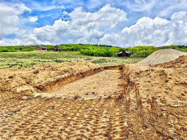a view of a big yard with a house