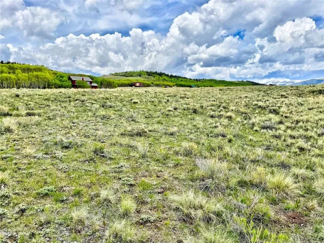 a view of a big yard with lots of buildings
