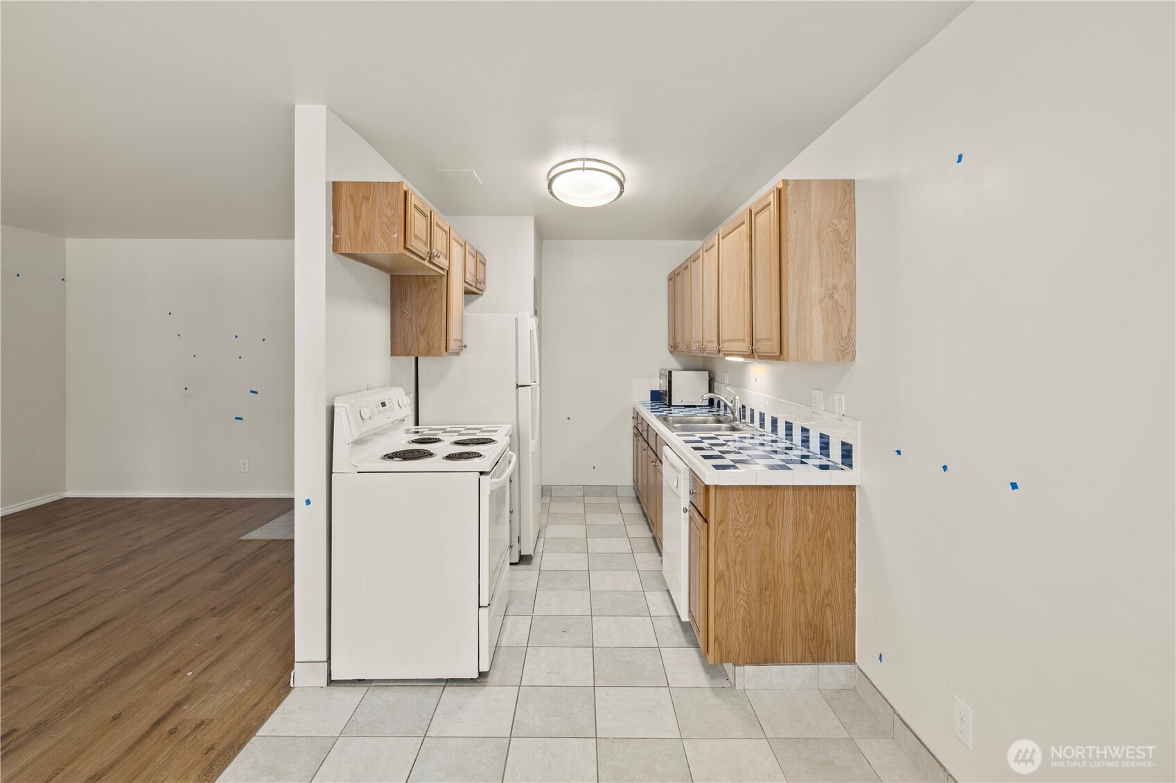 509 19th Avenue East Seattle, WA 98112 - Photo 11 of 40 a kitchen with stainless steel appliances a sink and a stove