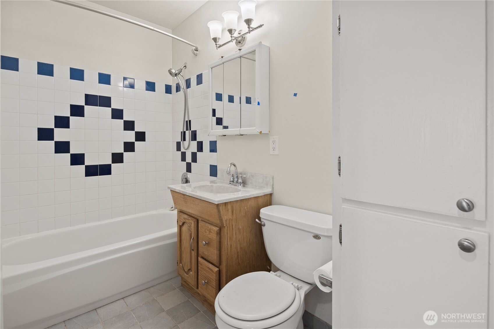 509 19th Avenue East Seattle, WA 98112 - Photo 17 of 40 a bathroom with a granite countertop sink a toilet and shower