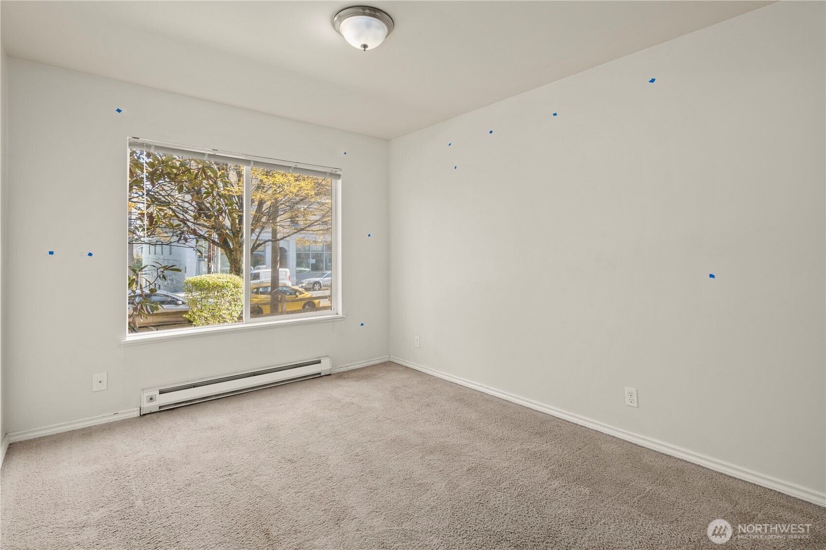 509 19th Avenue East Seattle, WA 98112 - Photo 19 of 40 an empty room with a window