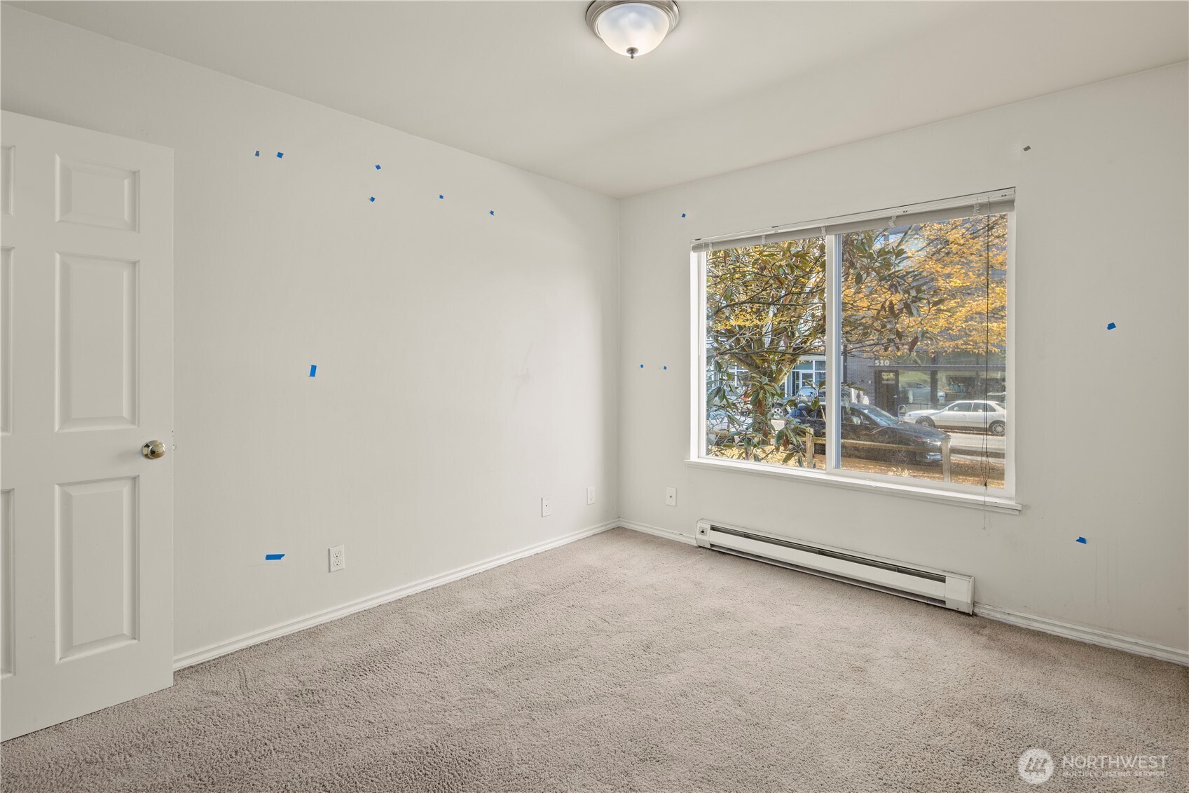 509 19th Avenue East Seattle, WA 98112 - Photo 20 of 40 a view of an empty room with a window