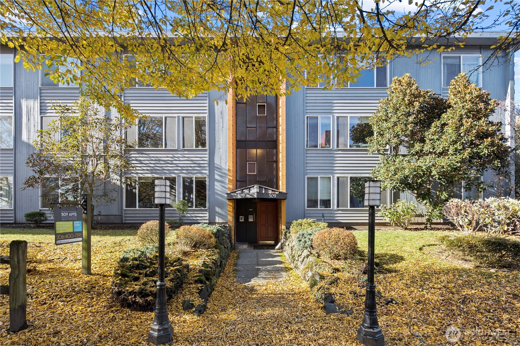 509 19th Avenue East Seattle, WA 98112 - Photo 2 of 40 a front view of a house with a yard