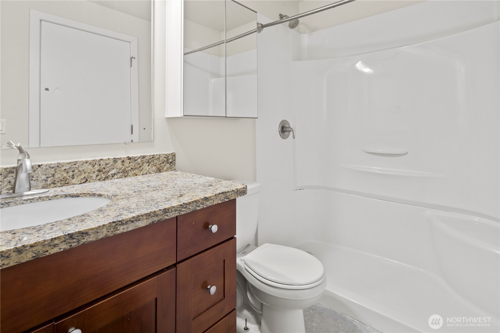 509 19th Avenue East Seattle, WA 98112 - Photo 26 of 40 a bathroom with a granite countertop sink toilet and shower