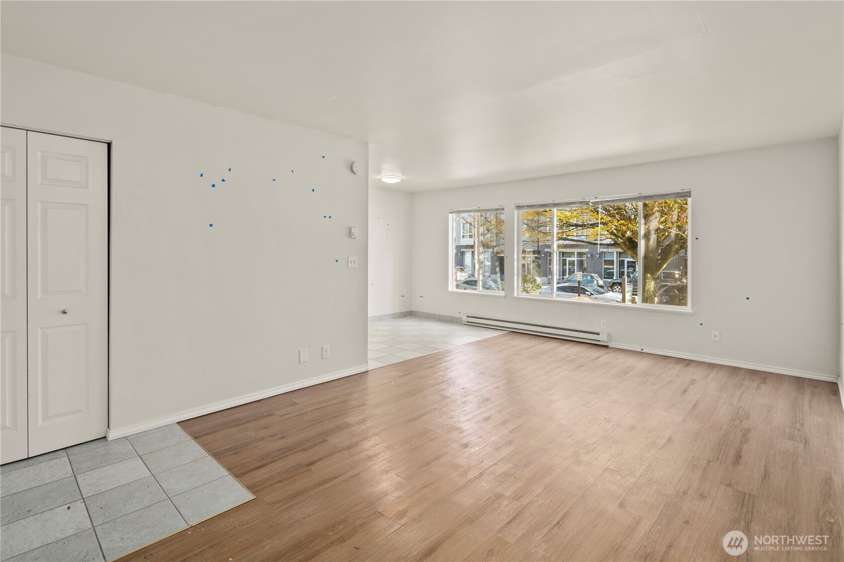 509 19th Avenue East Seattle, WA 98112 - Photo 7 of 40 an empty room with wooden floor and windows
