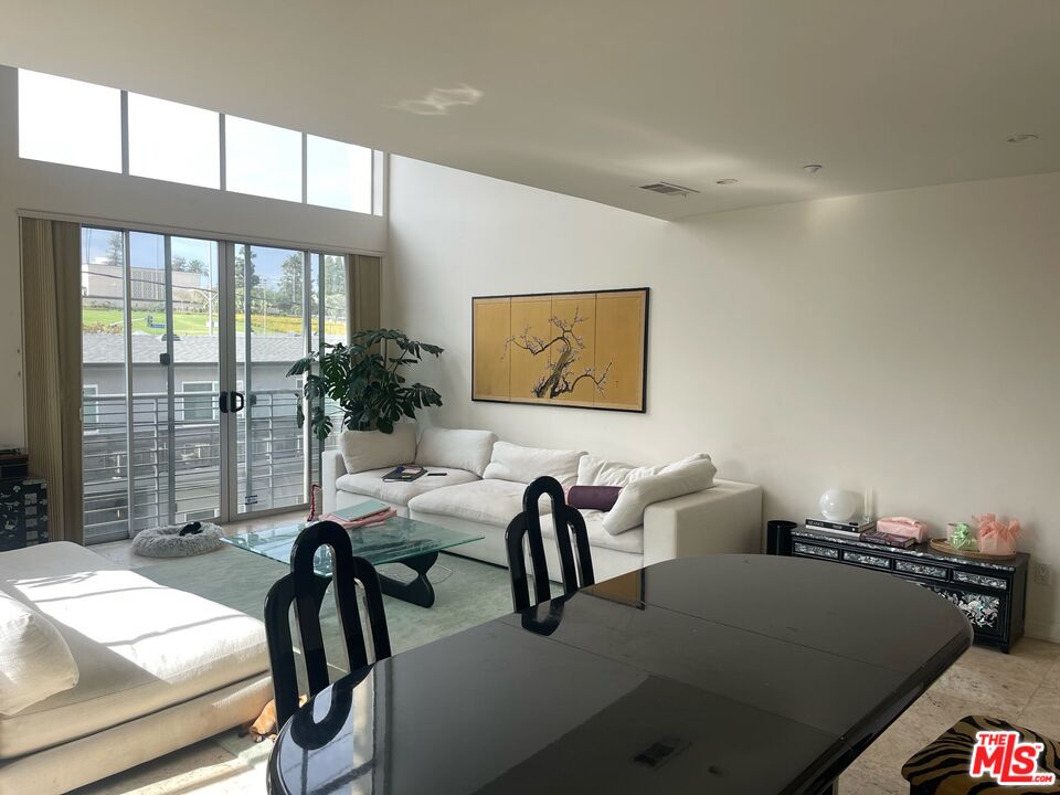 1809 Overland Avenue, Unit 5 Los Angeles, CA 90025 - Photo 2 of 15 a workspace with furniture and window