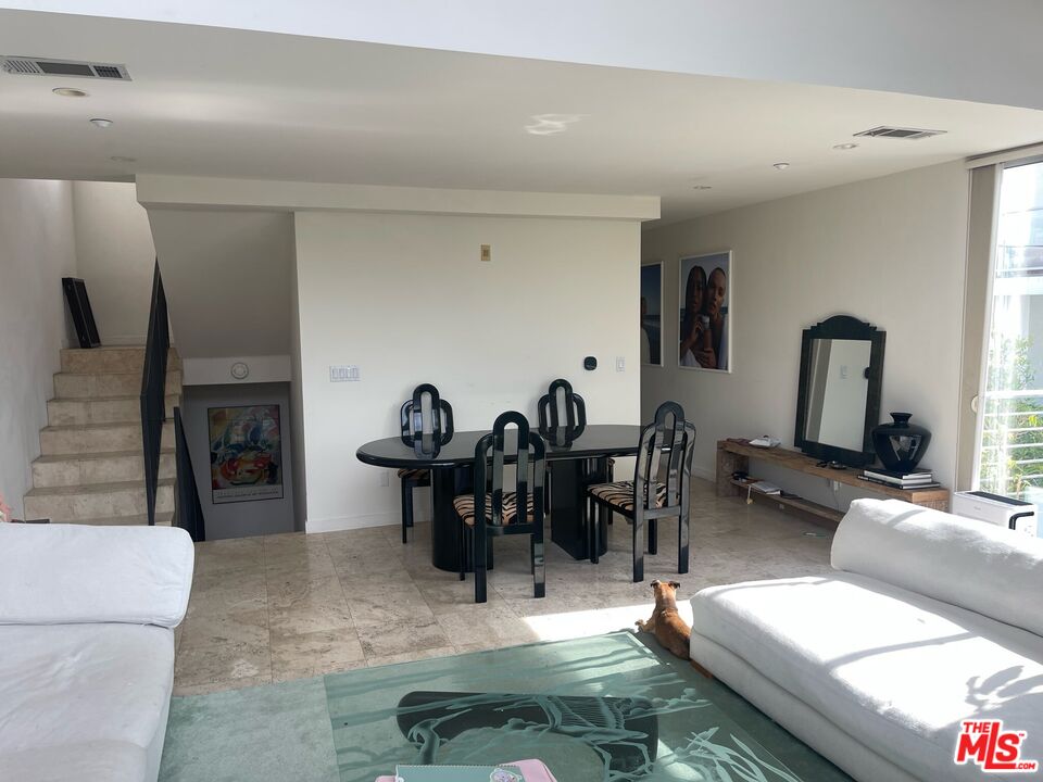 1809 Overland Avenue, Unit 5 Los Angeles, CA 90025 - Photo 4 of 15 a living room with fireplace furniture and a fireplace