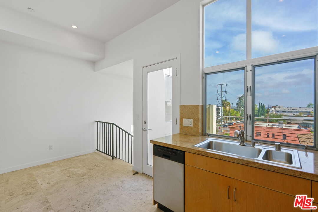 1809 Overland Avenue, Unit 5 Los Angeles, CA 90025 - Photo 10 of 15 a room with a large window and bed
