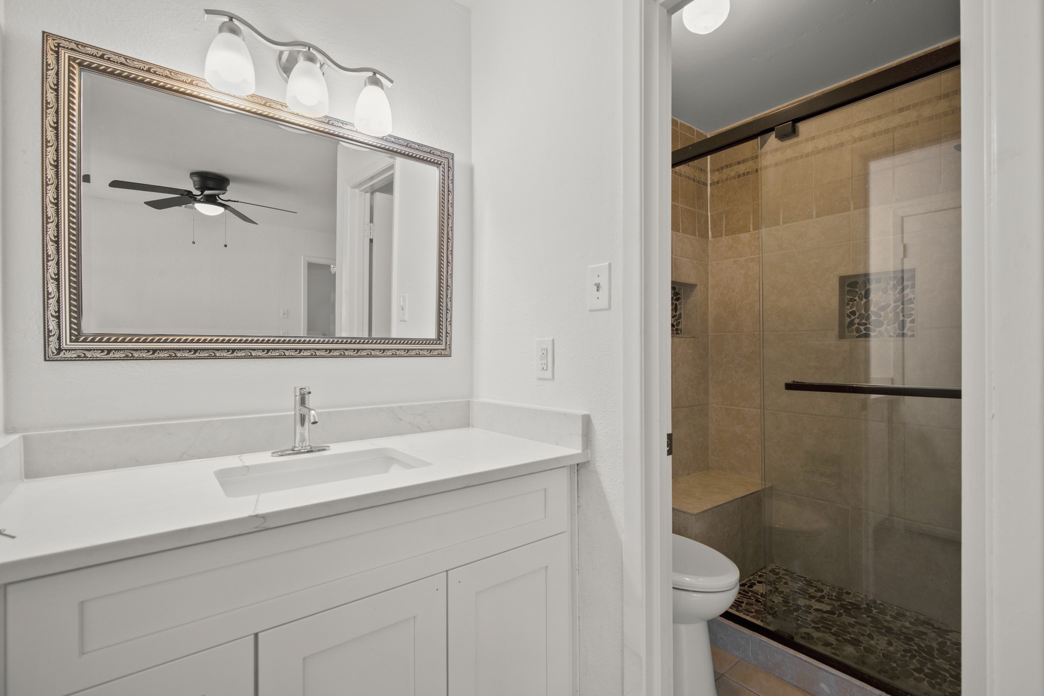 2109 Brandywine Lane Austin, TX 78727 - Photo 17 of 27 Full bath with vanity, a stall shower, and ceiling fan