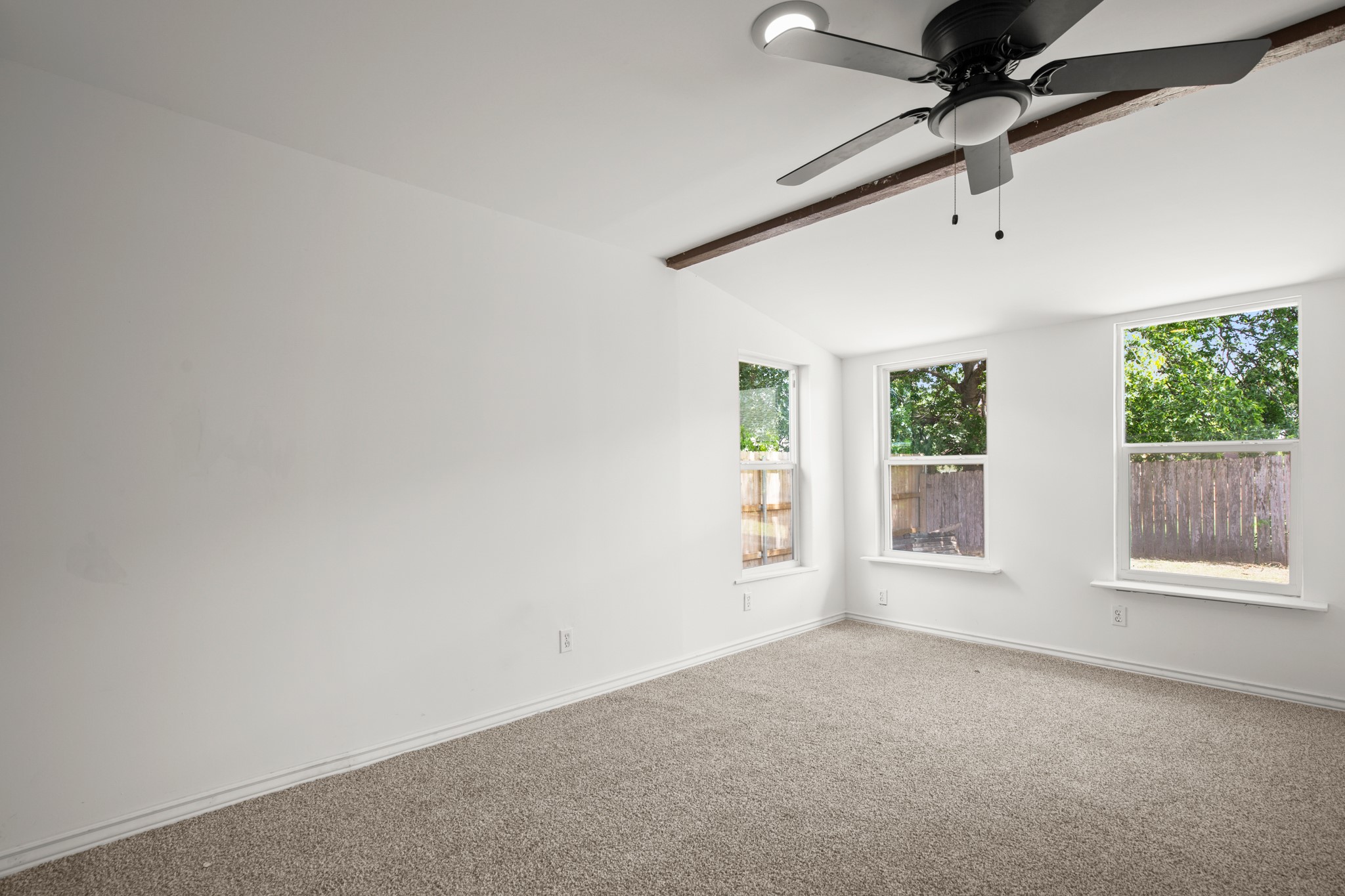 2109 Brandywine Lane Austin, TX 78727 - Photo 19 of 27 Spare room with a ceiling fan and carpet flooring