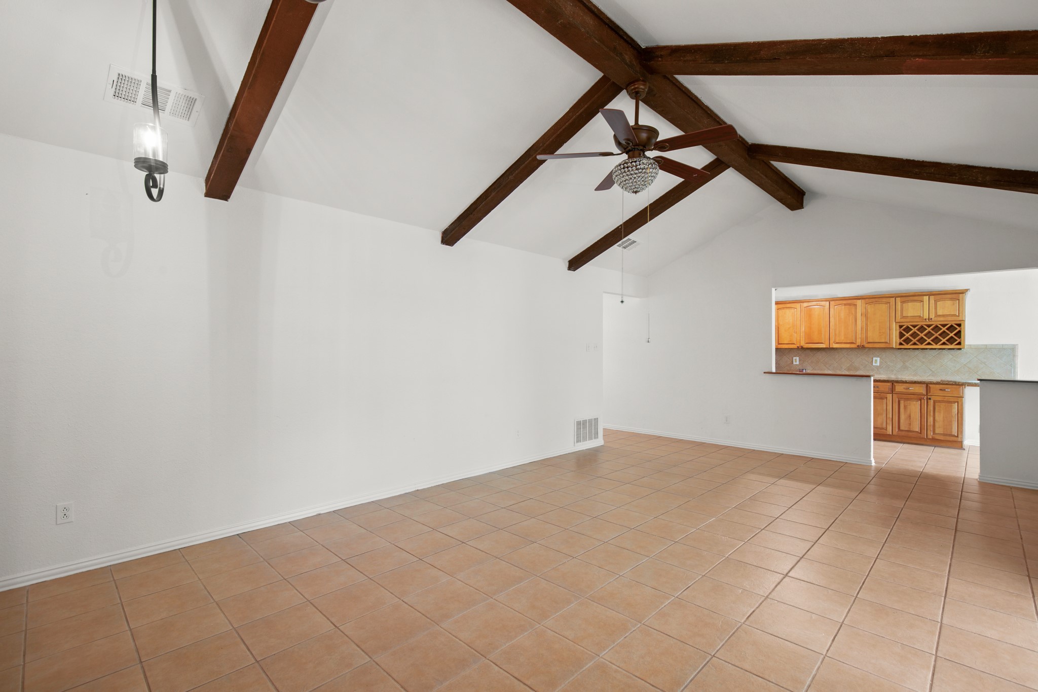 2109 Brandywine Lane Austin, TX 78727 - Photo 6 of 27 Unfurnished living room featuring ceiling fan and light tile patterned floors