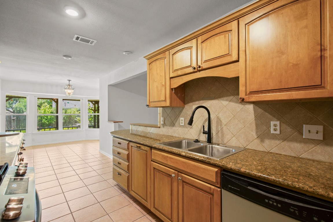 2109 Brandywine Lane Austin, TX 78727 - Photo 9 of 27 a kitchen with a sink and cabinets