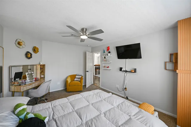 a bedroom with bed and a chandelier