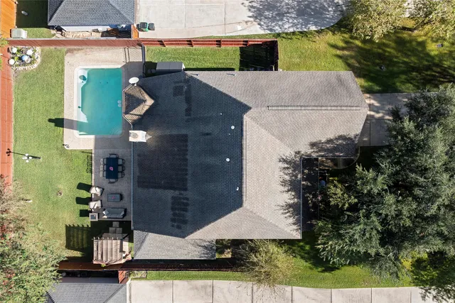 a front view of a house with a yard and a garage