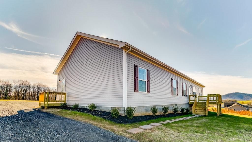 988 Calico Rock Road Rocky Mount, VA 24151 - Photo 2 of 41 a view of a house with a yard