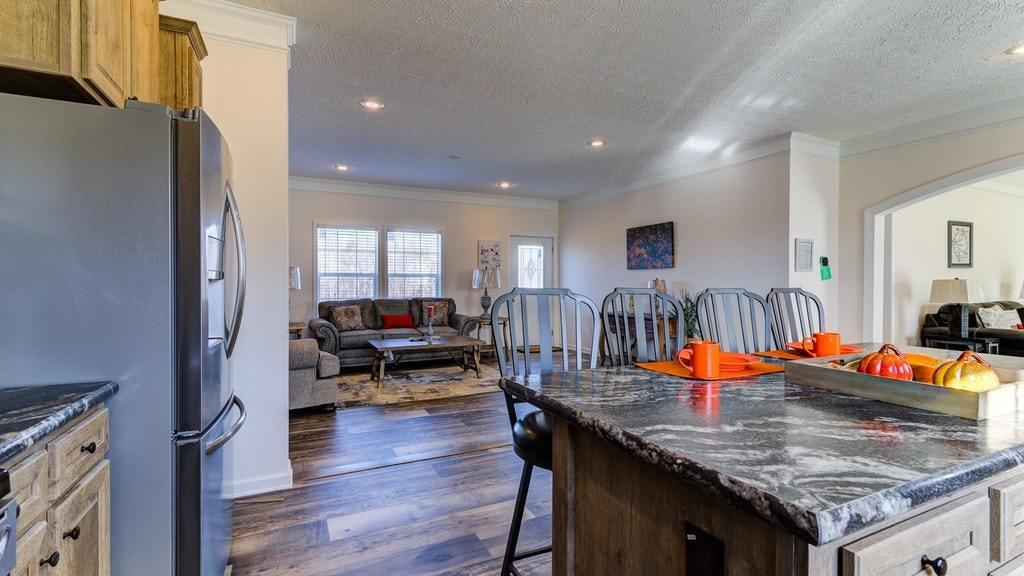 988 Calico Rock Road Rocky Mount, VA 24151 - Photo 11 of 41 an open kitchen with granite countertop a dining table chairs and couches
