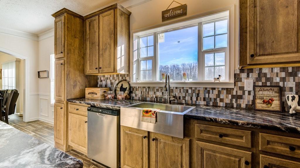 988 Calico Rock Road Rocky Mount, VA 24151 - Photo 13 of 41 a kitchen with stainless steel appliances granite countertop a stove a sink and a microwave