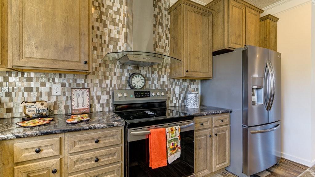 988 Calico Rock Road Rocky Mount, VA 24151 - Photo 14 of 41 a kitchen with stainless steel appliances granite countertop a refrigerator and a stove
