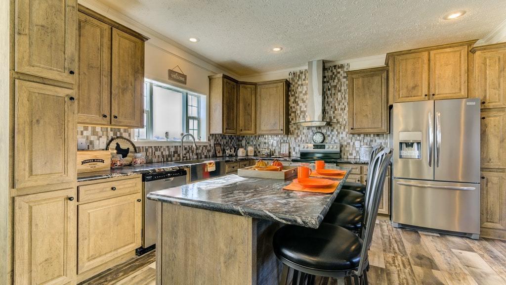 988 Calico Rock Road Rocky Mount, VA 24151 - Photo 15 of 41 a kitchen with stainless steel appliances granite countertop a sink and a refrigerator