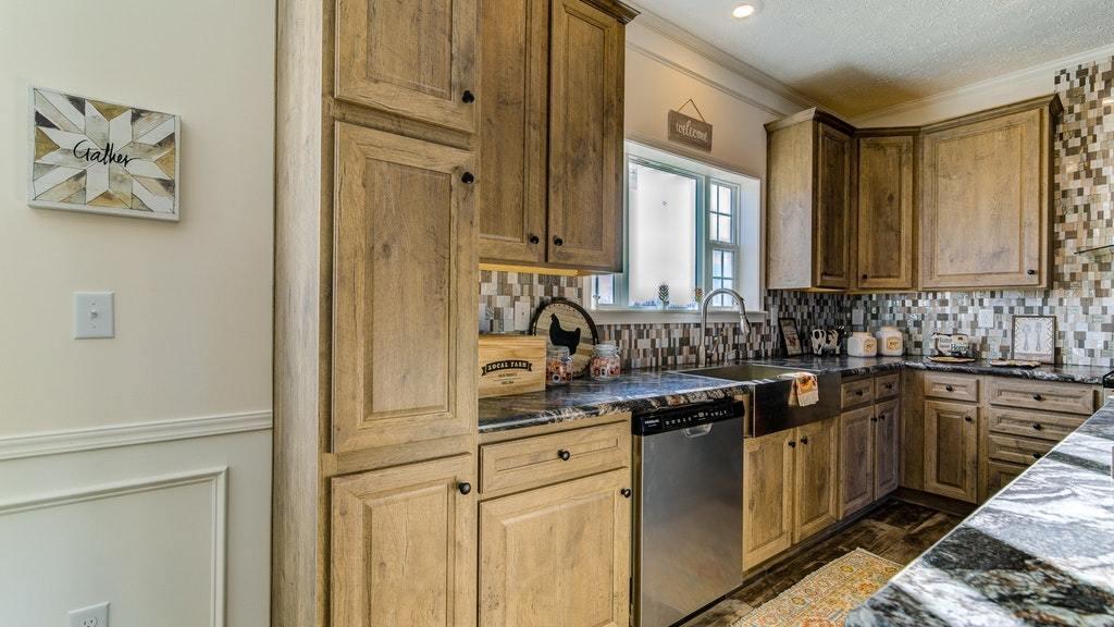 988 Calico Rock Road Rocky Mount, VA 24151 - Photo 16 of 41 a kitchen with stainless steel appliances granite countertop a sink stove and cabinets