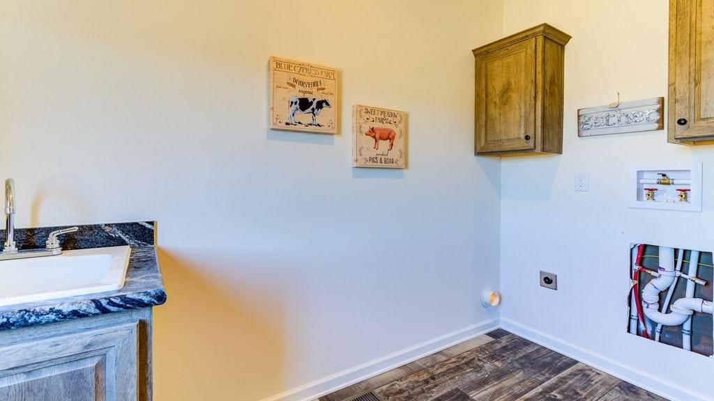988 Calico Rock Road Rocky Mount, VA 24151 - Photo 24 of 41 a bathroom with a sink and a mirror