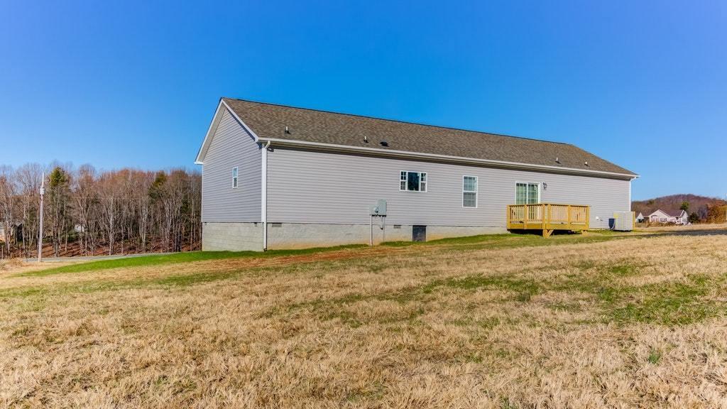 988 Calico Rock Road Rocky Mount, VA 24151 - Photo 40 of 41 a view of a house with backyard and trees
