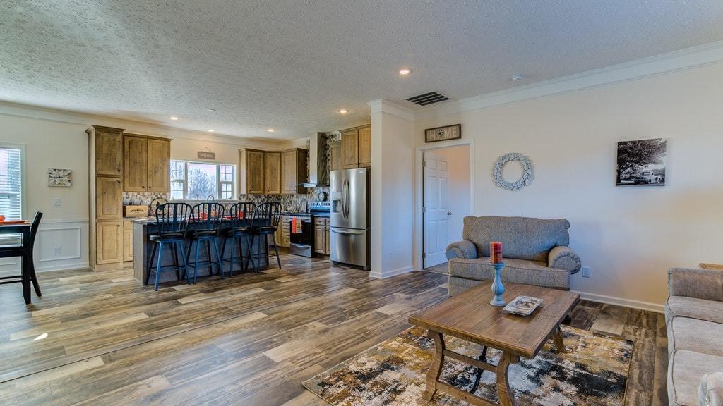988 Calico Rock Road Rocky Mount, VA 24151 - Photo 5 of 41 a living room with furniture and a wooden floor