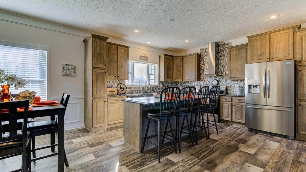 988 Calico Rock Road Rocky Mount, VA 24151 - Photo 9 of 41 a kitchen with stainless steel appliances granite countertop a dining table chairs and granite counter tops