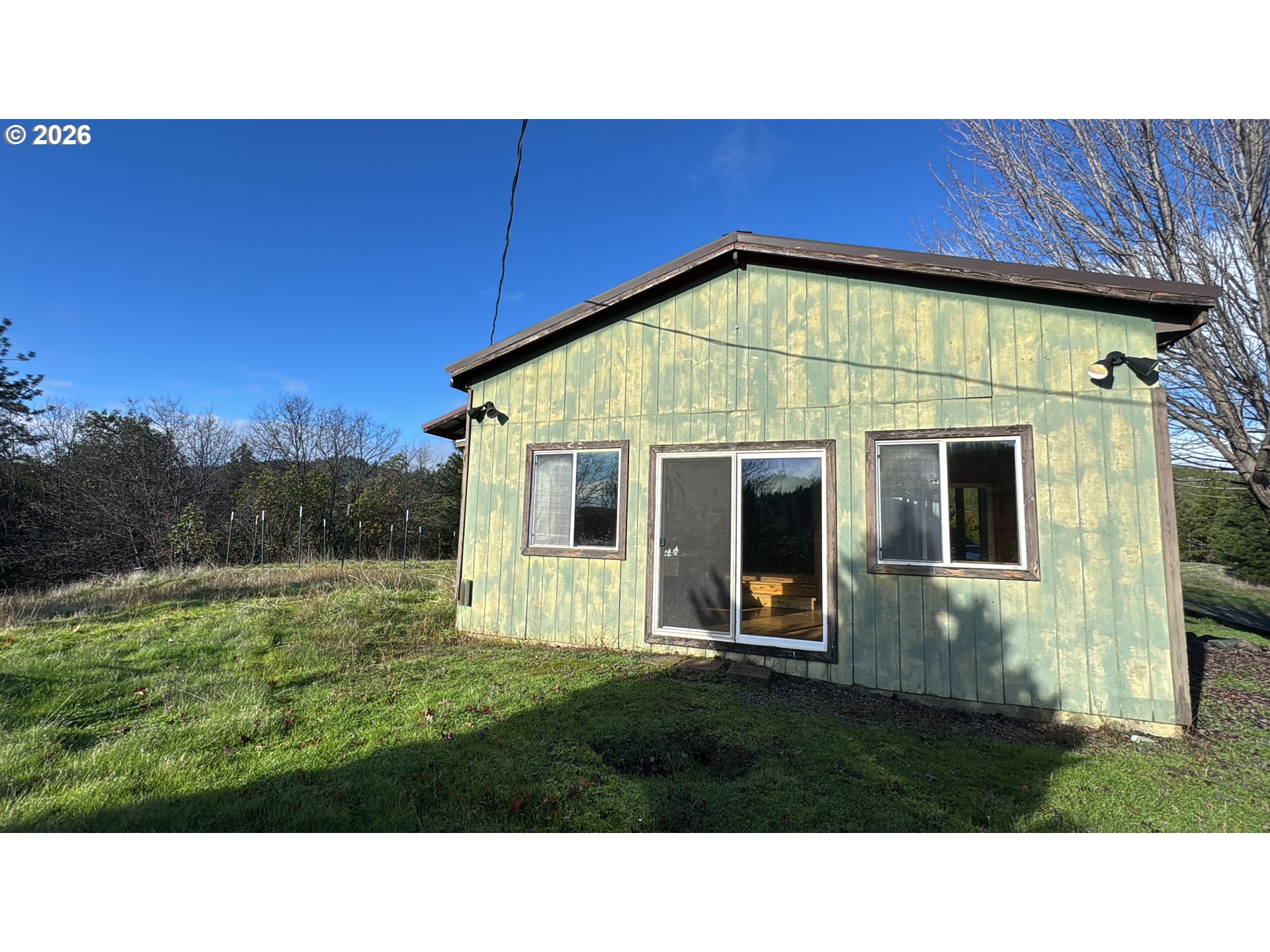 13469 Ramsey Road Gold Hill, OR 97525 - Photo 12 of 25 a black and white photo of a house