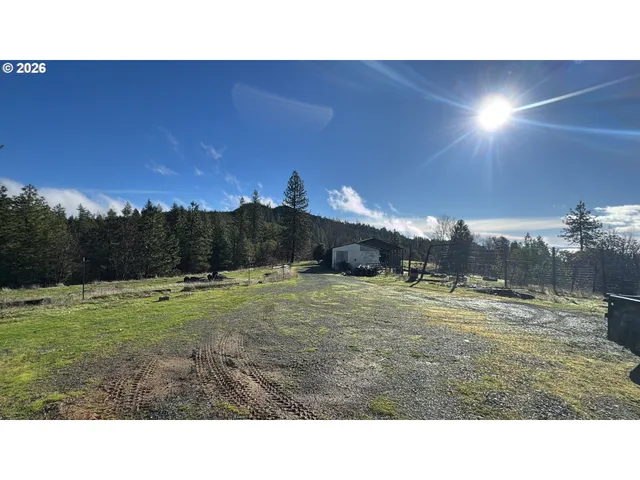a room with pool table and windows