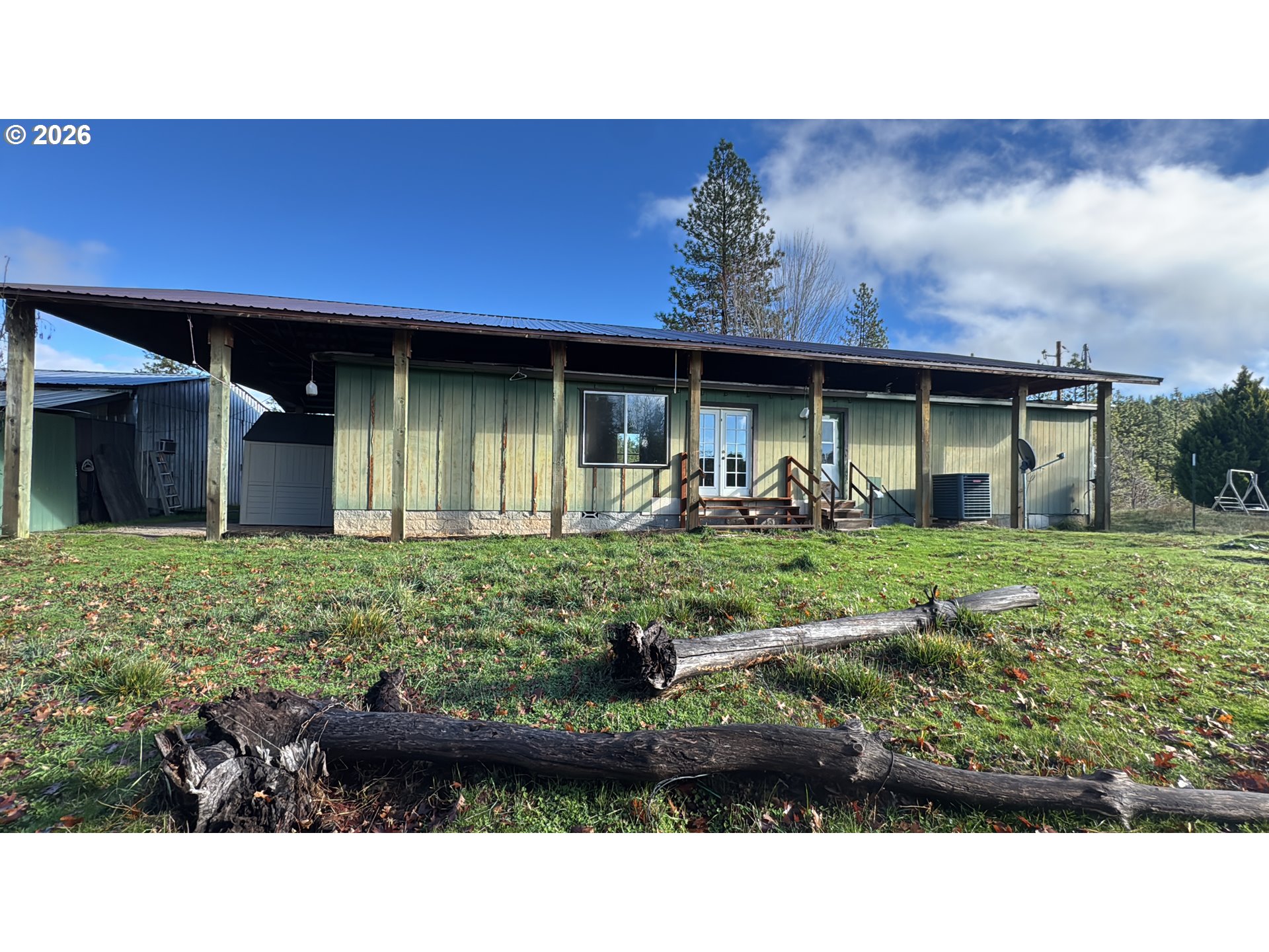13469 Ramsey Road Gold Hill, OR 97525 - Photo 19 of 25 a front view of a house with garden