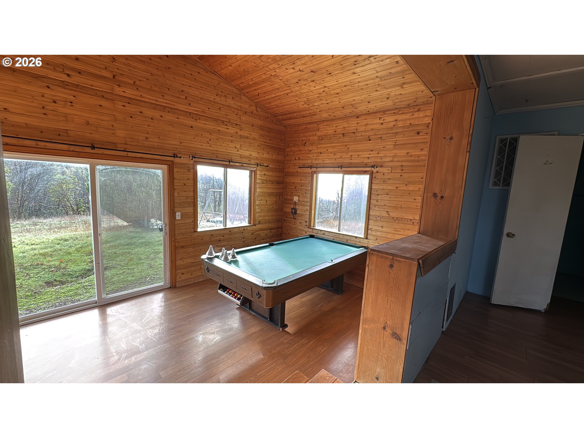 13469 Ramsey Road Gold Hill, OR 97525 - Photo 21 of 25 a room with pool table and windows