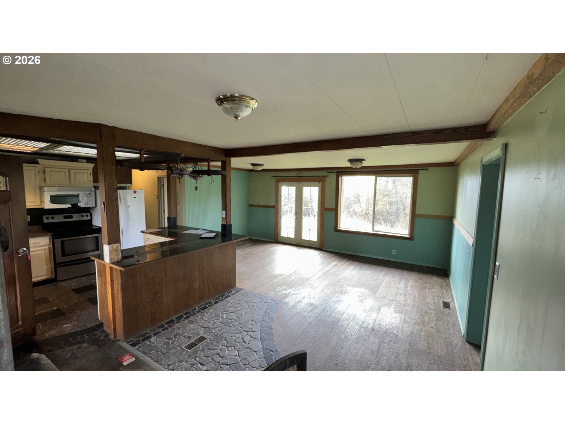 13469 Ramsey Road Gold Hill, OR 97525 - Photo 4 of 25 a living room with furniture and a window