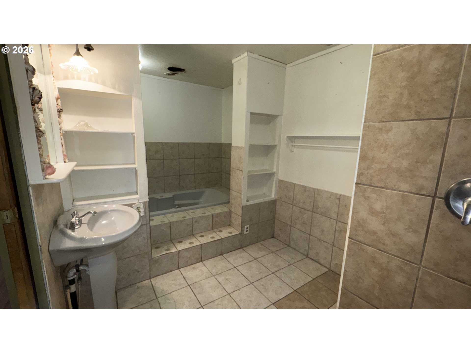 13469 Ramsey Road Gold Hill, OR 97525 - Photo 7 of 25 a bathroom with a sink and a shower