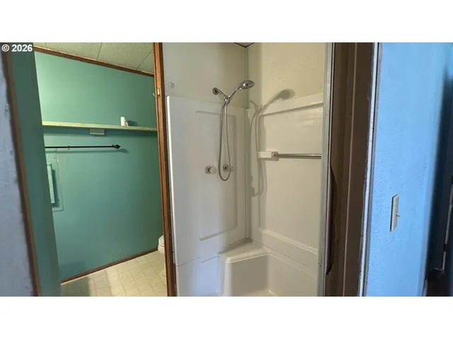 a bathroom with a sink and shower