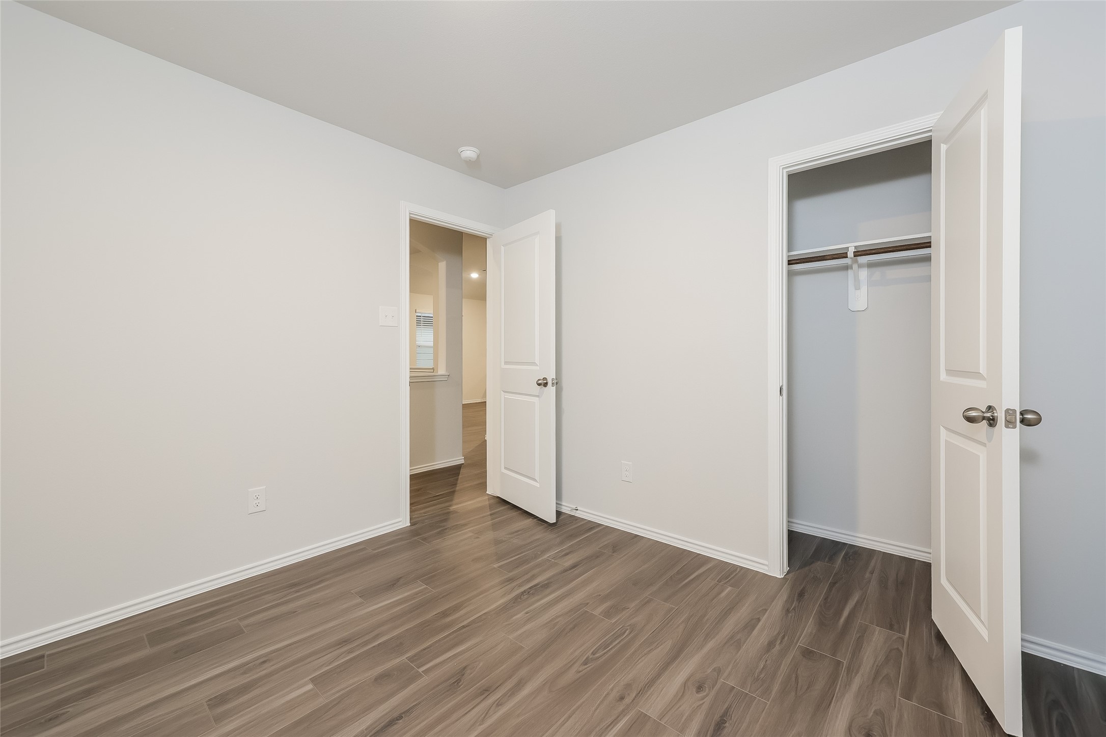 22211 Red Knot Run Splendora, TX 77372 - Photo 11 of 18 a view of an empty room with wooden floor