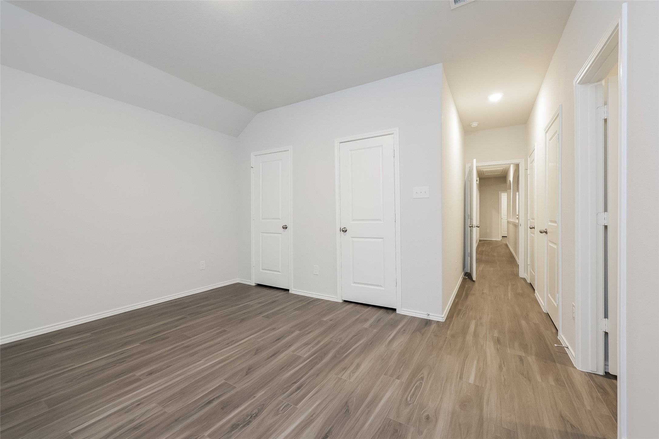 22211 Red Knot Run Splendora, TX 77372 - Photo 7 of 18 wooden floor in a hall with an empty room