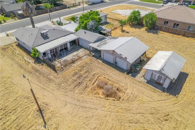 an aerial view of residential house with parking