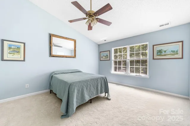 a bed room with a bed and a window