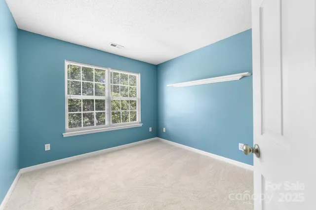 a view of a big room with windows