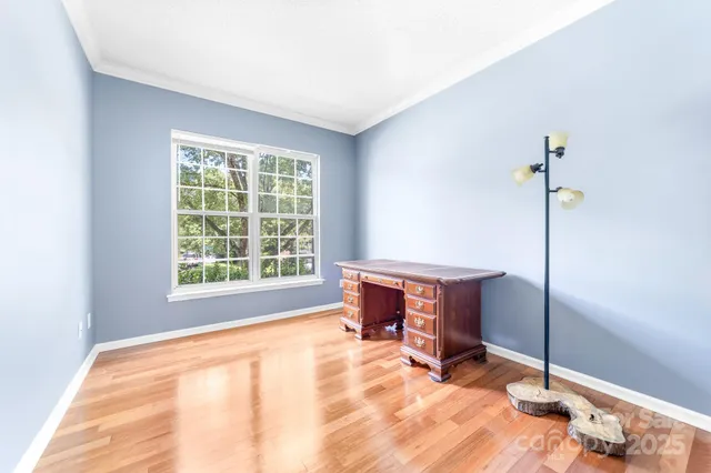 a room with a bed and a window