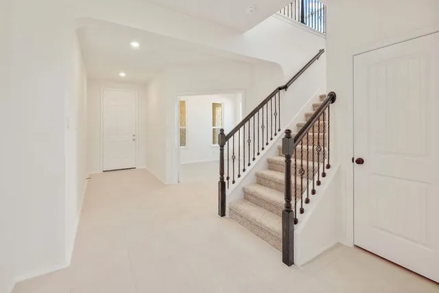 a view of staircase with white walls and white floor