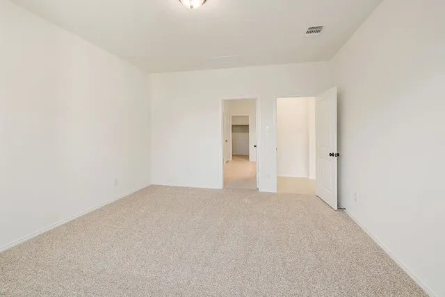 a bathroom with a granite countertop sink mirror and shower